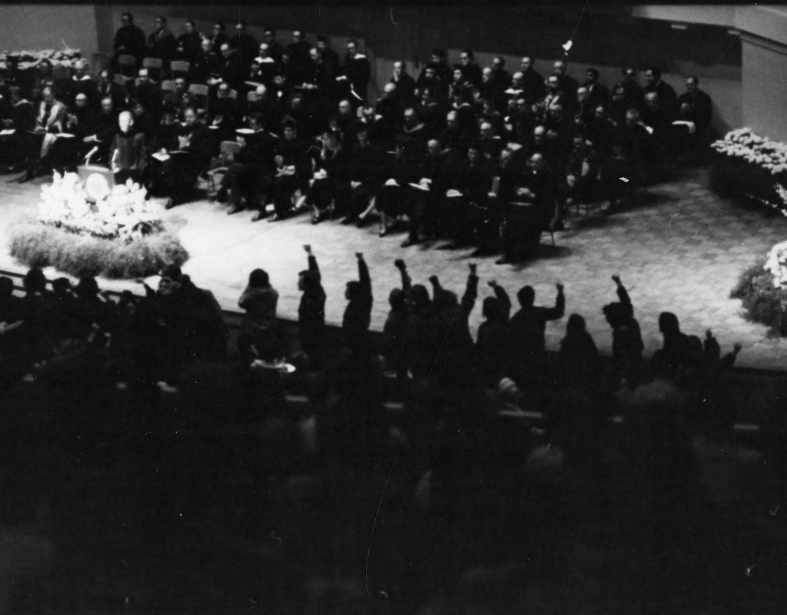 A photo of raised fists in support of the Black Action Movement at the March 1970 convocation.